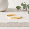 Gold This Too Shall Pass But Fucking Hell Cuff Bracelet on neutral background