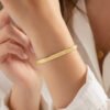 This Too Shall Pass But Fucking Hell Bracelet worn as minimalist gold cuff jewelry